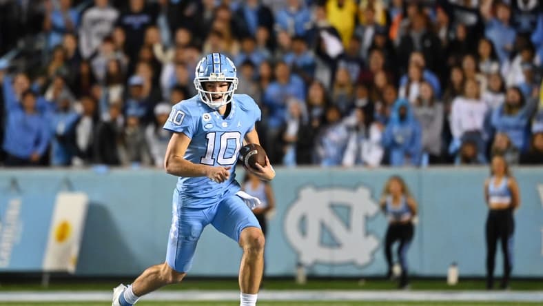Oct 29, 2022; Chapel Hill, North Carolina, USA; *North Carolina Tar Heels quarterback Drake Maye (10) with the ball in the third quarter at Kenan Memorial Stadium. Mandatory Credit: Bob Donnan-USA TODAY Sports