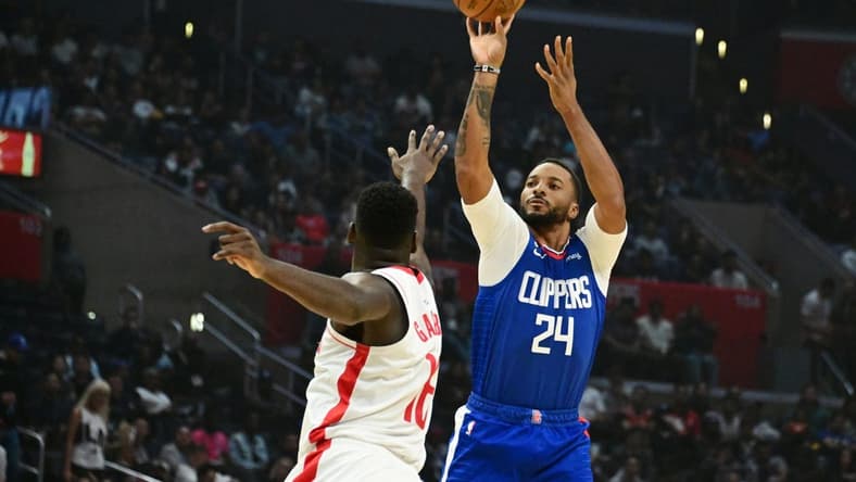 Oct 31, 2022; Los Angeles, California, USA; LA Clippers forward Norman Powell (24) shoots the ball over Houston Rockets forward Usman Garuba (16) in the first half  at Crypto.com Arena. Mandatory Credit: Richard Mackson-USA TODAY Sports