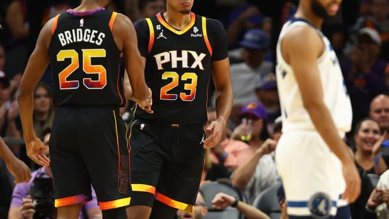 Nov 1, 2022; Phoenix, Arizona, USA; Phoenix Suns forward Cameron Johnson (23) celebrates a play with Mikal Bridges (25) against the Minnesota Timberwolves in the first half at Footprint Center. Mandatory Credit: Mark J. Rebilas-USA TODAY Sports