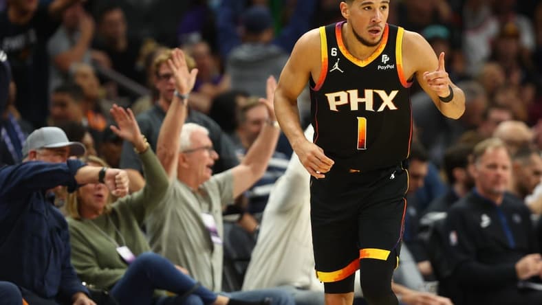 Nov 1, 2022; Phoenix, Arizona, USA; Phoenix Suns guard Devin Booker (1) celebrates a shot against the Minnesota Timberwolves in the second half at Footprint Center. Mandatory Credit: Mark J. Rebilas-USA TODAY Sports