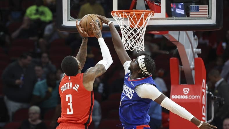 Nov 2, 2022; Houston, Texas, USA; Los Angeles Clippers guard Reggie Jackson (1) attempts to strip the ball from Houston Rockets guard Kevin Porter Jr. (3) during the first quarter at Toyota Center. Mandatory Credit: Troy Taormina-USA TODAY Sports