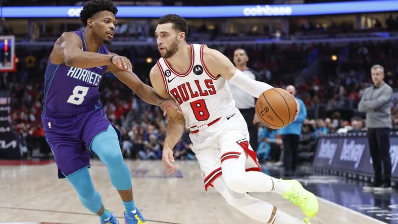 Nov 2, 2022; Chicago, Illinois, USA; Chicago Bulls guard Zach LaVine (8) drives to the basket against Charlotte Hornets guard Dennis Smith Jr. (8) during the first half at United Center. Mandatory Credit: Kamil Krzaczynski-USA TODAY Sports