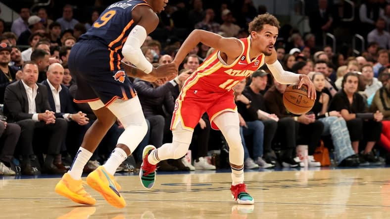 Nov 2, 2022; New York, New York, USA; Atlanta Hawks guard Trae Young (11) controls the ball against New York Knicks guard RJ Barrett (9) during the first quarter at Madison Square Garden. Mandatory Credit: Brad Penner-USA TODAY Sports