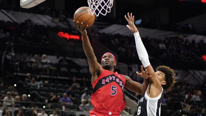 Nov 2, 2022; San Antonio, Texas, USA; Toronto Raptors forward Precious Achiuwa (5) drives to the basket against San Antonio Spurs forward Dominick Barlow (26) during the second half at AT&T Center. Mandatory Credit: Scott Wachter-USA TODAY Sports