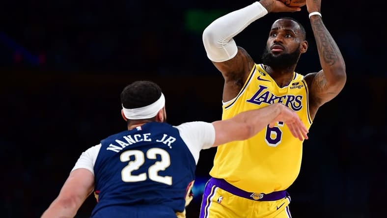 Nov 2, 2022; Los Angeles, California, USA; Los Angeles Lakers forward LeBron James (6) shoots against New Orleans Pelicans forward Larry Nance Jr. (22) during the first half at Crypto.com Arena. Mandatory Credit: Gary A. Vasquez-USA TODAY Sports