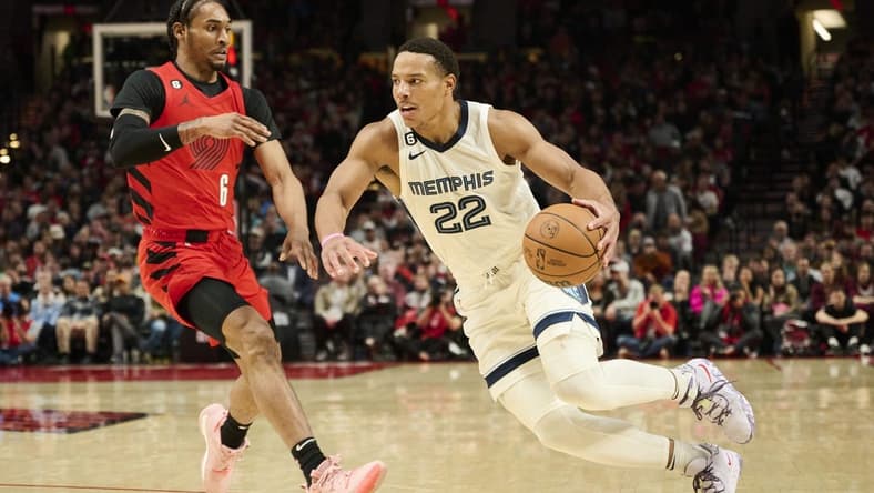 Nov 2, 2022; Portland, Oregon, USA; Memphis Grizzlies guard Desmond Bane (22) drives to the basket against Portland Trail Blazers guard Keon Johnson (6) during the second half at Moda Center. Mandatory Credit: Troy Wayrynen-USA TODAY Sports