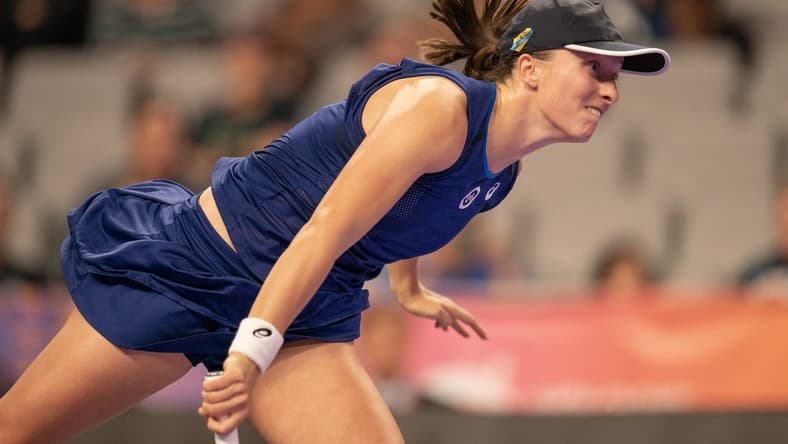 Nov 3, 2022; Forth Worth, TX, USA; Iga Swiatek (POL) serves during her match against Caroline Garcia (FRA) on day four of the WTA Finals at Dickies Arena. Mandatory Credit: Susan Mullane-USA TODAY Sports