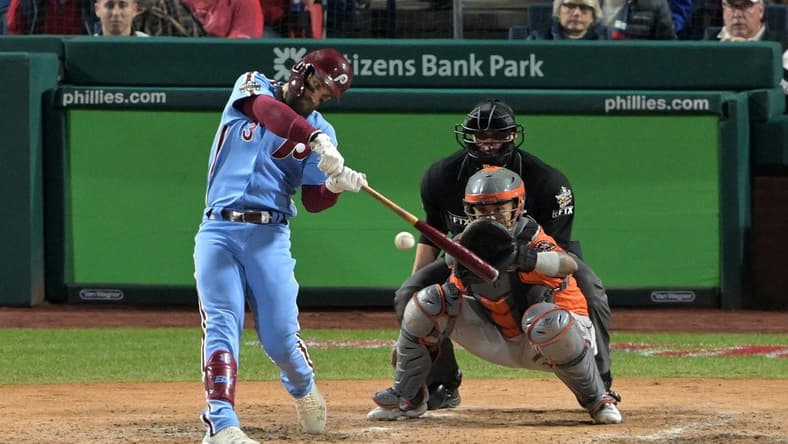 Nov 3, 2022; Philadelphia, Pennsylvania, USA; Philadelphia Phillies designated hitter Bryce Harper (3) hits a double against the Houston Astros during the fifth inning in game five of the 2022 World Series at Citizens Bank Park. Mandatory Credit: John Geliebter-USA TODAY Sports