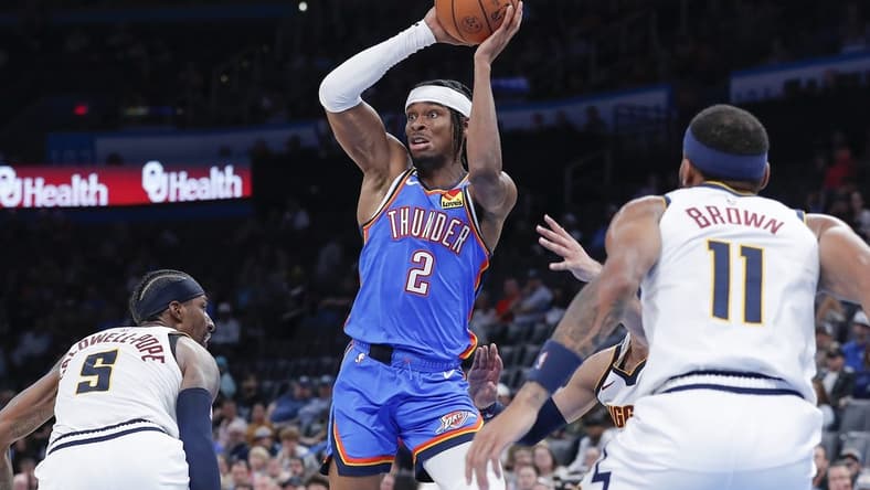 Nov 3, 2022; Oklahoma City, Oklahoma, USA; Oklahoma City Thunder guard Shai Gilgeous-Alexander (2) passes the ball against the Denver Nuggets during the second half at Paycom Center. Denver won 122-110. Mandatory Credit: Alonzo Adams-USA TODAY Sports
