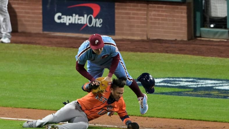 Nov 3, 2022; Philadelphia, Pennsylvania, USA; Philadelphia Phillies first baseman Rhys Hoskins (17) makes the tag on Houston Astros first baseman Yuli Gurriel (10) in a run down during the seventh inning in game five of the 2022 World Series at Citizens Bank Park. Mandatory Credit: John Geliebter-USA TODAY Sports