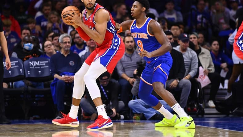 Nov 4, 2022; Philadelphia, Pennsylvania, USA; Philadelphia 76ers forward Tobias Harris (12) holds the ball against New York Knicks forward RJ Barrett (9) in the second quarter at Wells Fargo Center. Mandatory Credit: Kyle Ross-USA TODAY Sports