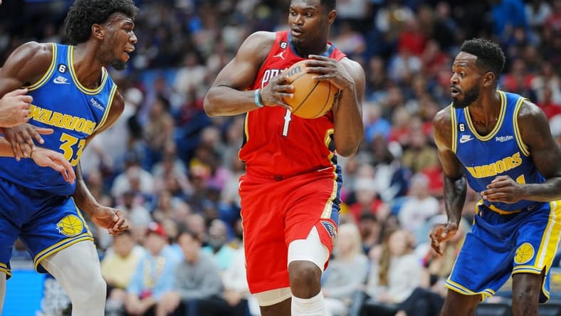 Nov 4, 2022; New Orleans, Louisiana, USA; New Orleans Pelicans forward Zion Williamson (1) recovers the ball against Golden State Warriors center James Wiseman (33) during the first quarter at Smoothie King Center. Mandatory Credit: Andrew Wevers-USA TODAY Sports