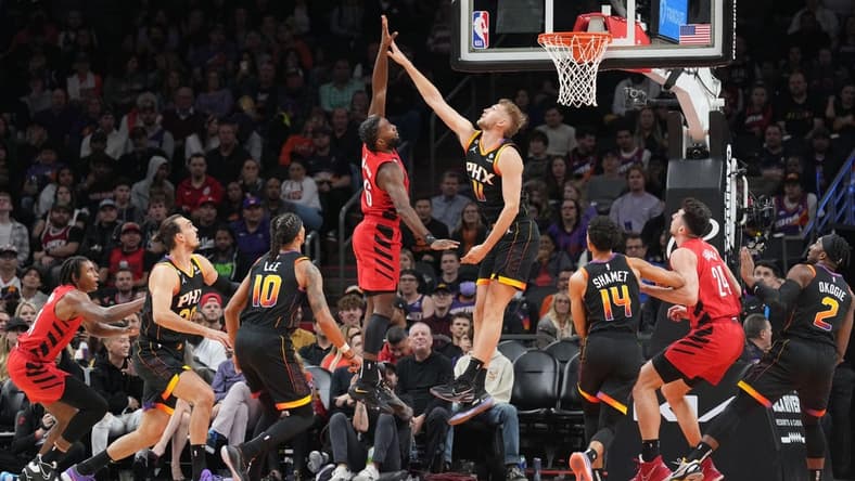Nov 4, 2022; Phoenix, Arizona, USA; Portland Trail Blazers guard Keon Johnson (6) shoots over Phoenix Suns center Jock Landale (11) during the first half at Footprint Center. Mandatory Credit: Joe Camporeale-USA TODAY Sports
