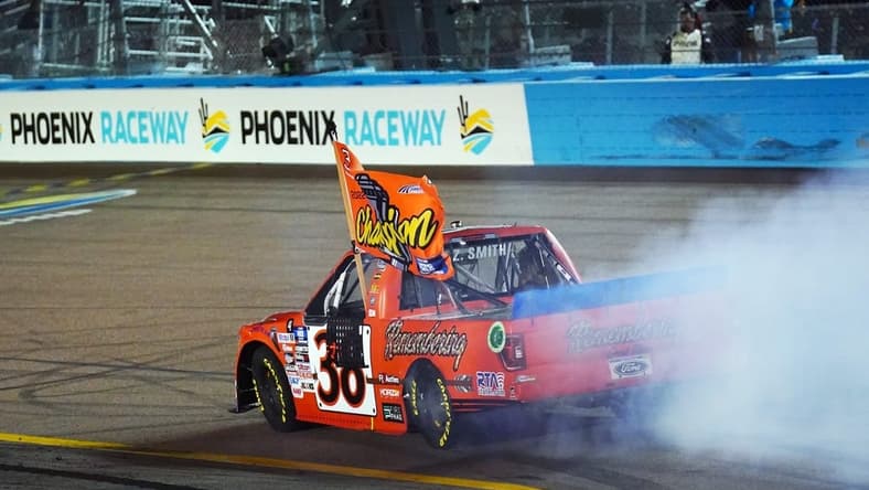 Nov 4, 2022; Avondale, Arizona, USA; Camping World Truck Series driver Zane Smith (38) celebrates winning the Truck Series Championship at Phoenix Raceway. Mandatory Credit: John David Mercer-USA TODAY Sports