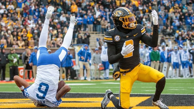 Nov 5, 2022; Columbia, Missouri, USA; Missouri Tigers defensive back Ennis Rakestraw Jr. (2) reacts in the end zone as Kentucky Wildcats wide receiver Dane Key (6) makes a reception for a touch down during the first quarter at Faurot Field at Memorial Stadium. Mandatory Credit: William Purnell-USA TODAY Sports