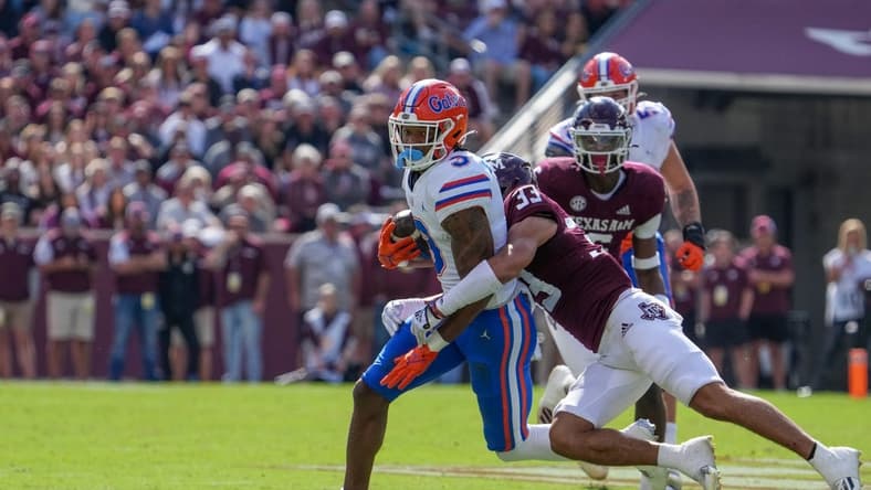 Nov 5, 2022; College Station, Texas, USA;  Florida Gators wide receiver Xzavier Henderson (3) is tackled by Texas A&M Aggies defensive back Jarred Kerr (33) in the first half at Kyle Field. Mandatory Credit: Daniel Dunn-USA TODAY Sports