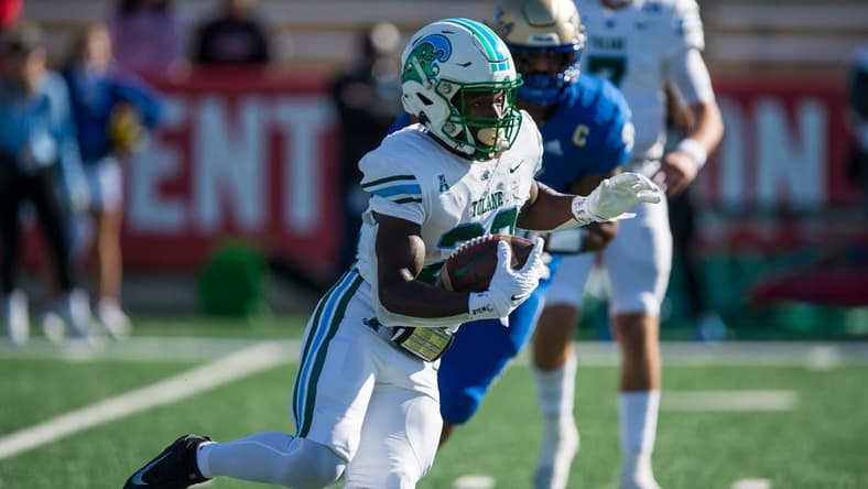 Nov 5, 2022; Tulsa, Oklahoma, USA; Tulane Green Wave running back Tyjae Spears (22) runs the ball during the first quarter against the Tulsa Golden Hurricane at Skelly Field at H.A. Chapman Stadium. Mandatory Credit: Brett Rojo-USA TODAY Sports
