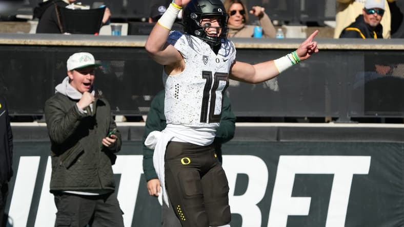 Nov 5, 2022; Boulder, Colorado, USA; Oregon Ducks quarterback Bo Nix (10) celebrates his touchdown reception in in the first quarter against the Colorado Buffaloes at Folsom Field. Mandatory Credit: Ron Chenoy-USA TODAY Sports