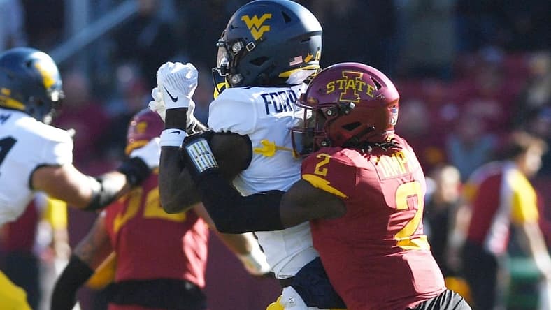 Iowa State Cyclones defensive back T.J. Tampa (2) knocks the ball out from West Virginia Mountaineers wide receiver Bryce Ford-Wheaton (0) during the first half in the Big-12 showdown at Jack Trice Stadium Saturday, Nov. 5. 2022, in Ames, Iowa.

Ncaa Football Baylor At Iowa State