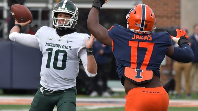 Nov 5, 2022; Champaign, Illinois, USA;  Michigan State Spartans quarterback Payton Thorne (10) passes the ball as Illinois Fighting Illini linebacker Gabe Jacas (17) pressures during the first half at Memorial Stadium. Mandatory Credit: Ron Johnson-USA TODAY Sports