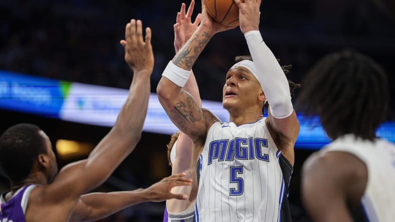 Nov 5, 2022; Orlando, Florida, USA; Orlando Magic forward Paolo Banchero (5) shoots the ball against the Sacramento Kings in the fourth quarter at Amway Center. Mandatory Credit: Nathan Ray Seebeck-USA TODAY Sports