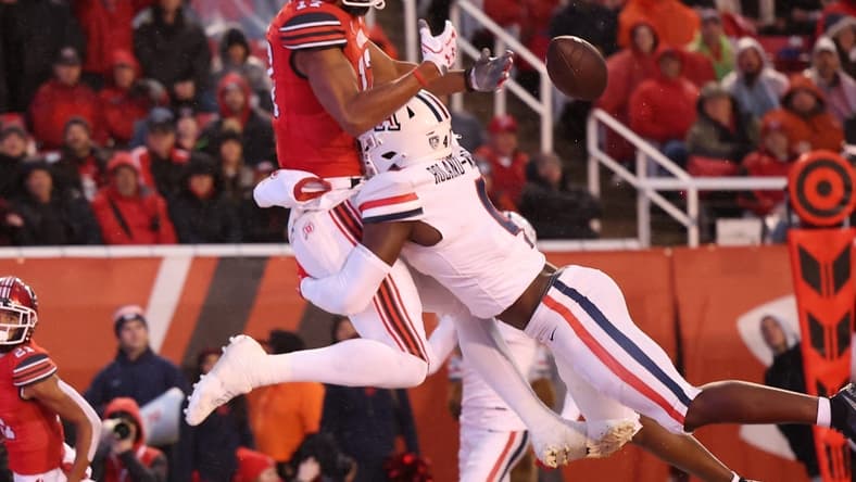 Nov 5, 2022; Salt Lake City, Utah, USA; Utah Utes wide receiver Devaughn Vele (17) has a pass knocked away by Arizona Wildcats cornerback Christian Roland-Wallace (4) in the first quarter at Rice-Eccles Stadium. Mandatory Credit: Rob Gray-USA TODAY Sports