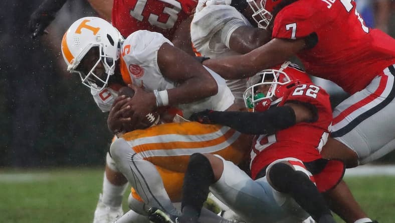 Tennessee quarterback Hendon Hooker (5) is sacked by Georgia defensive back Javon Bullard (22) during the second half of a NCAA college football game between Tennessee and Georgia in Athens, Ga., on Saturday, Nov. 5, 2022. Georgia won 27-13.
News Joshua L Jones