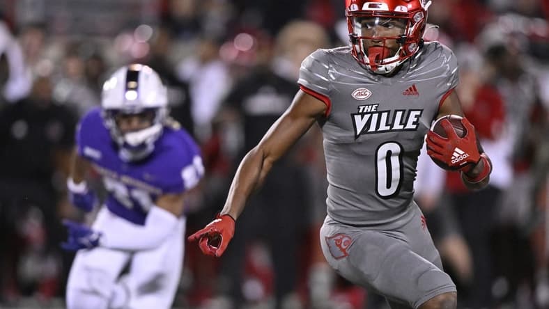 Nov 5, 2022; Louisville, Kentucky, USA; Louisville Cardinals wide receiver Tyler Hudson (0) runs the ball against the James Madison Dukes during the first half at Cardinal Stadium. Mandatory Credit: Jamie Rhodes-USA TODAY Sports