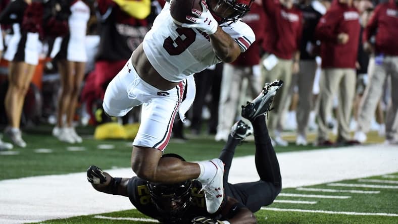 Nov 5, 2022; Nashville, Tennessee, USA; South Carolina Gamecocks wide receiver Antwane Wells Jr. (3) dives into the end zone past a tackle attempt from Vanderbilt Commodores cornerback BJ Anderson (26) during the first half at FirstBank Stadium. Mandatory Credit: Christopher Hanewinckel-USA TODAY Sports