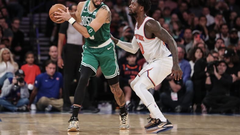 Nov 5, 2022; New York, New York, USA; Boston Celtics forward Jayson Tatum (0) is guarded by New York Knicks forward Julius Randle (30) in the fourth quarter at Madison Square Garden. Mandatory Credit: Wendell Cruz-USA TODAY Sports