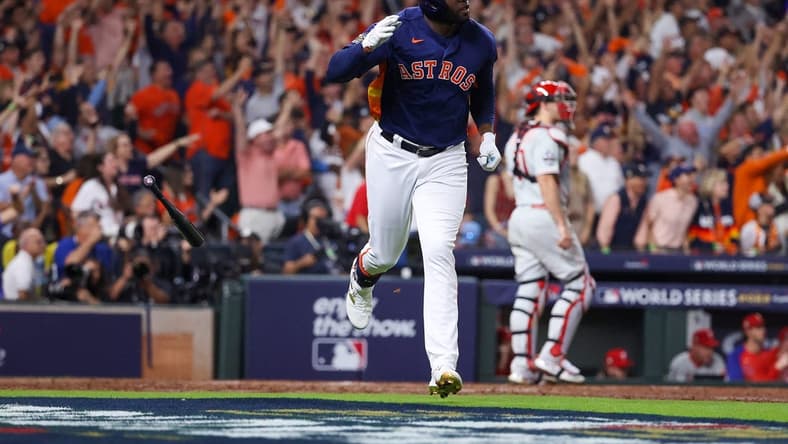 Nov 5, 2022; Houston, Texas, USA; Houston Astros left fielder Yordan Alvarez (44) flips his bat after hitting a three run against the Philadelphia Phillies during the sixth inning in game six of the 2022 World Series at Minute Maid Park. Mandatory Credit: Troy Taormina-USA TODAY Sports