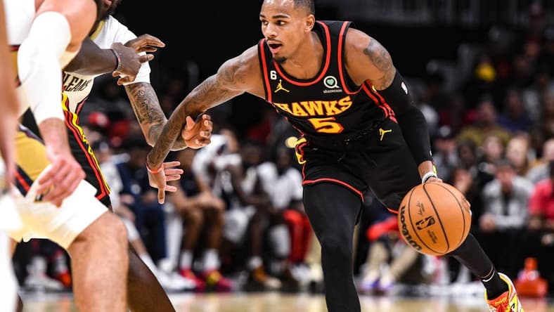 Nov 5, 2022; Atlanta, Georgia, USA; Atlanta Hawks guard Dejounte Murray (5) drives the ball against the New Orleans Pelicans in the fourth quarter at State Farm Arena. Mandatory Credit: Larry Robinson-USA TODAY Sports