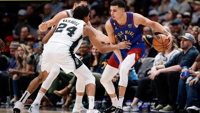 Nov 5, 2022; Denver, Colorado, USA; Denver Nuggets forward Michael Porter Jr. (1) controls the ball under pressure from San Antonio Spurs guard Devin Vassell (24) and forward Doug McDermott (17) in the fourth quarter at Ball Arena. Mandatory Credit: Isaiah J. Downing-USA TODAY Sports