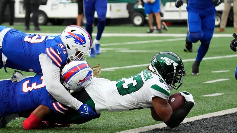 Nov 6, 2022; East Rutherford, NJ, USA;
New York Jets running back James Robinson (23) scores a 4th quarter touchdown against the Bills at MetLife Stadium. Mandatory Credit: Robert Deutsch-USA TODAY Sports