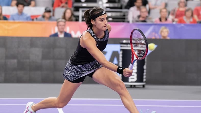 Nov 6, 2022; Forth Worth, TX, USA; Caroline Garcia (FRA) returns a shot during her match against Maria Sakkari (GRE) on day seven of the WTA Finals at Dickies Arena. Mandatory Credit: Susan Mullane-USA TODAY Sports