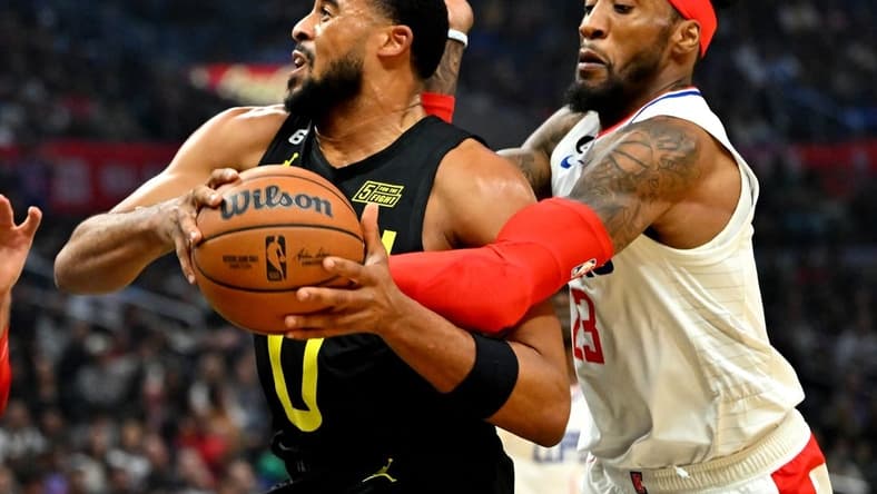 Nov 6, 2022; Los Angeles, California, USA; Utah Jazz guard Talen Horton-Tucker (0) is fouled by Los Angeles Clippers forward Robert Covington (23) in the first half at Crypto.com Arena. Mandatory Credit: Jayne Kamin-Oncea-USA TODAY Sports