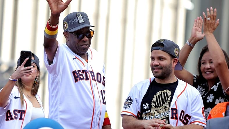 Nov 7, 2022; Houston, Texas, USA; Houston Astros manager Dusty Baker Jr. (12, left) and Houston Astros second baseman Jose Altuve (27) both wave to the crowd atop a parade vehicle during the Houston Astros Championship Parade in Houston, TX. Mandatory Credit: Erik Williams-USA TODAY Sports