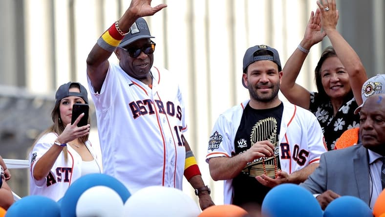 Nov 7, 2022; Houston, Texas, USA; Houston Astros manager Dusty Baker Jr. (12, left) and Houston Astros second baseman Jose Altuve (27) both wave to the crowd atop a parade vehicle during the Houston Astros Championship Parade in Houston, TX. Mandatory Credit: Erik Williams-USA TODAY Sports
