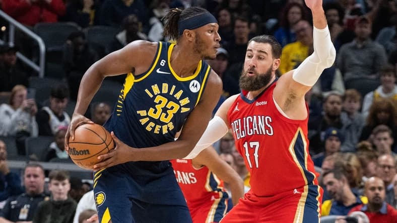 Nov 7, 2022; Indianapolis, Indiana, USA; Indiana Pacers center Myles Turner (33) looks to pass the ball while New Orleans Pelicans center Jonas Valanciunas (17) defends in the second quarter at Gainbridge Fieldhouse. Mandatory Credit: Trevor Ruszkowski-USA TODAY Sports