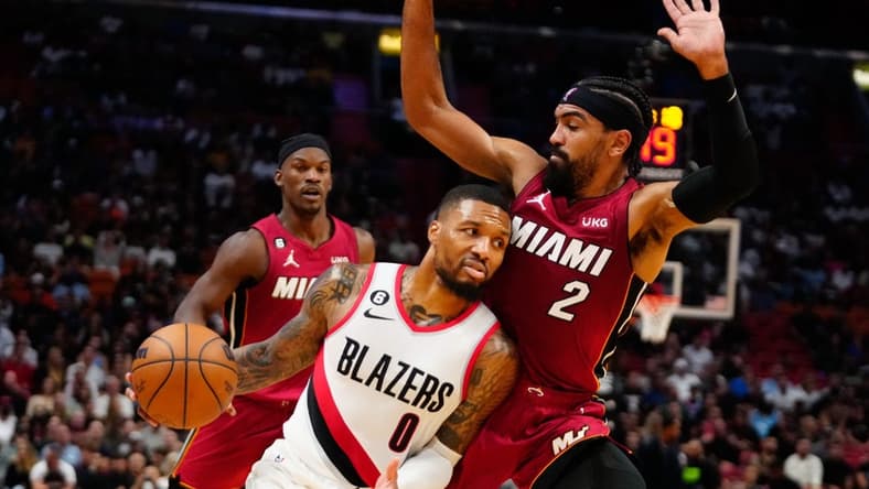 Nov 7, 2022; Miami, Florida, USA; Portland Trail Blazers guard Damian Lillard (0) drives past Miami Heat guard Gabe Vincent (2) during the second quarter at FTX Arena. Mandatory Credit: Rich Storry-USA TODAY Sports