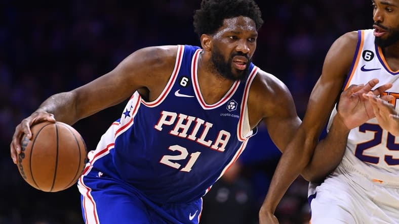Nov 7, 2022; Philadelphia, Pennsylvania, USA; Philadelphia 76ers center Joel Embiid (21) drives against Phoenix Suns forward Mikal Bridges (25) in the second quarter at Wells Fargo Center. Mandatory Credit: Kyle Ross-USA TODAY Sports