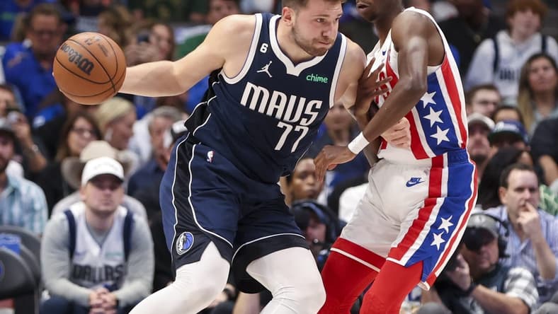 Nov 7, 2022; Dallas, Texas, USA; Dallas Mavericks guard Luka Doncic (77) looks to shoot as Brooklyn Nets guard Edmond Sumner (4) defends during the first quarter at American Airlines Center. Mandatory Credit: Kevin Jairaj-USA TODAY Sports