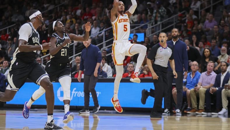 Nov 7, 2022; Atlanta, Georgia, USA; Atlanta Hawks guard Dejounte Murray (5) shoots against the Milwaukee Bucks in the first quarter at State Farm Arena. Mandatory Credit: Brett Davis-USA TODAY Sports