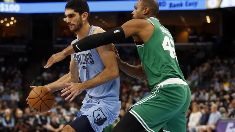 Nov 7, 2022; Memphis, Tennessee, USA; Memphis Grizzlies forward Santi Aldama (7) spins toward the basket as Boston Celtics center Al Horford (42) defends during the first half at FedExForum. Mandatory Credit: Petre Thomas-USA TODAY Sports