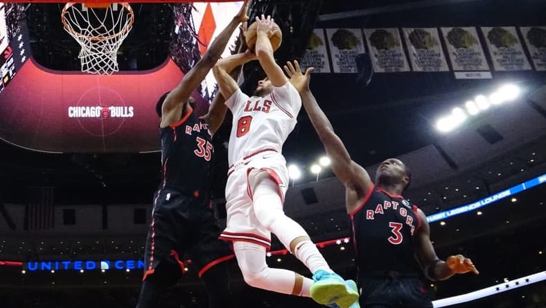 Nov 7, 2022; Chicago, Illinois, USA; Toronto Raptors forward Christian Koloko (35) forward O.G. Anunoby (3) defends Chicago Bulls guard Zach LaVine (8) during the second half at United Center. Mandatory Credit: David Banks-USA TODAY Sports
