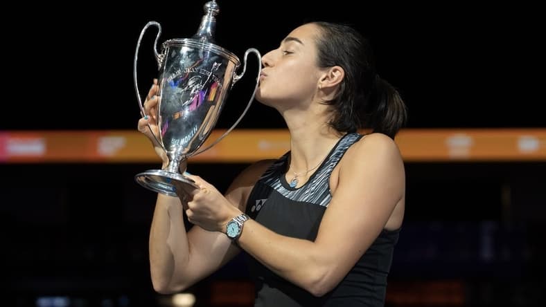 Nov 7, 2022; Forth Worth, TX, USA; Caroline Garcia (FRA) kisses the trophy after winning the WTA Finals in singles after defeating Aryna Sabalenka on day eight of the WTA Finals at Dickies Arena.
