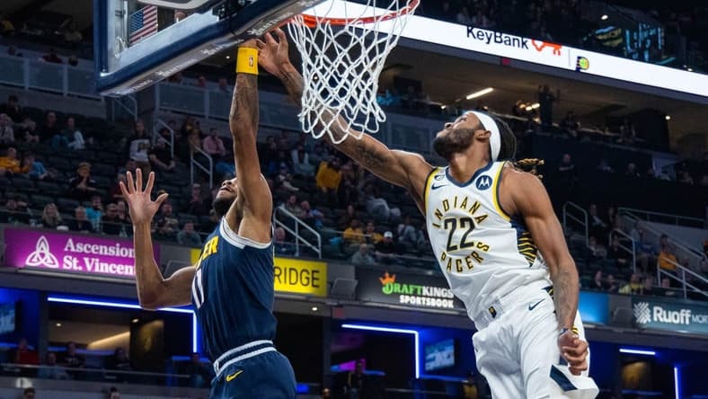 Nov 9, 2022; Indianapolis, Indiana, USA; Indiana Pacers forward Isaiah Jackson (22) and Denver Nuggets forward Bruce Brown (11) fight for a rebound in the second quarter at Gainbridge Fieldhouse. Mandatory Credit: Trevor Ruszkowski-USA TODAY Sports