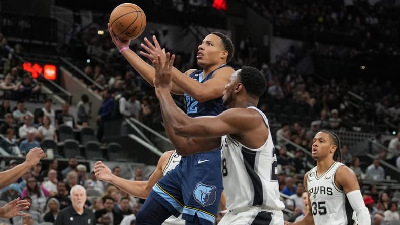 Nov 9, 2022; San Antonio, Texas, USA; Memphis Grizzlies guard Desmond Bane (22) shoots in front of San Antonio Spurs center Charles Bassey (28) in the first half at the AT&T Center. Mandatory Credit: Daniel Dunn-USA TODAY Sports
