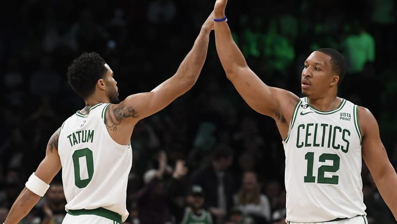 Nov 9, 2022; Boston, Massachusetts, USA; Boston Celtics forward Grant Williams (12) high fives forward Jayson Tatum (0) during the second half against the Detroit Pistons at TD Garden. Mandatory Credit: Bob DeChiara-USA TODAY Sports