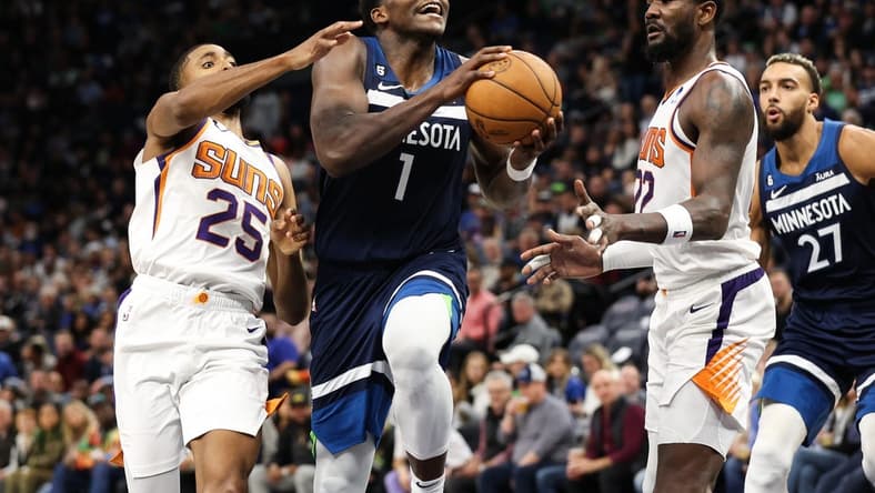 Nov 9, 2022; Minneapolis, Minnesota, USA; Minnesota Timberwolves guard Anthony Edwards (1) drives to the basket while Phoenix Suns forward Mikal Bridges (25) defends during the second quarter at Target Center. Mandatory Credit: Matt Krohn-USA TODAY Sports